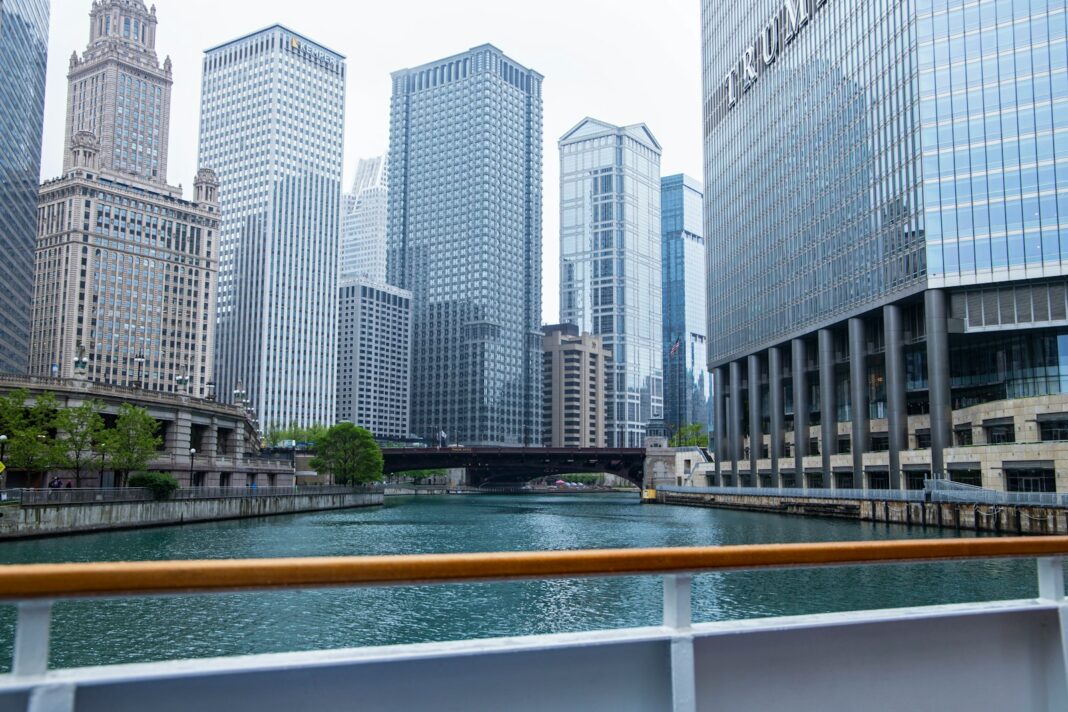 a river running through a city next to tall buildings